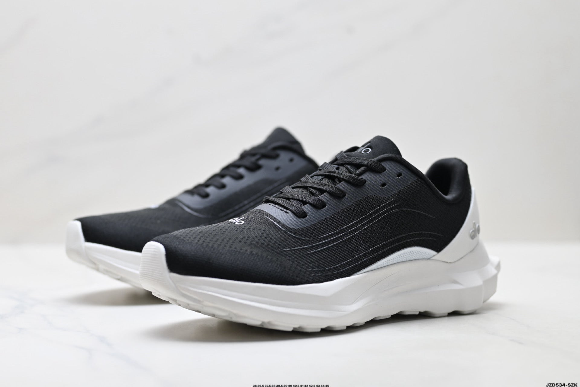 Alo Yoga Alo Runner – Breathable Mesh Low-Top Sneaker | City Commute & Training Black and White